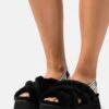 Ugg Disco Cross Slide - Pantoffels - Black 10 Ugg Disco Cross Slide - Pantoffels - Black -Ugg Winkel 42ed0fa8931e44ce8edf31223c44e6b1